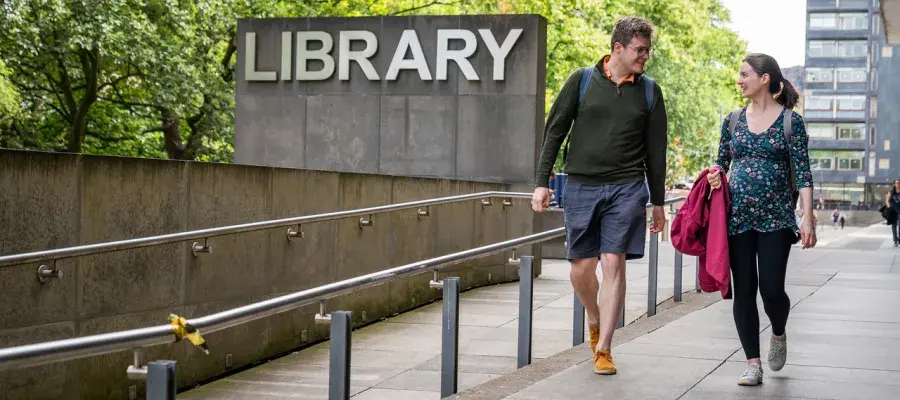 Students talking and walking outside the Main Library (looking towards 40 George Square)  [Laurence Winram]
