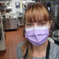 Cristina Puntaru in a professional kitchen. Staff volunteering.