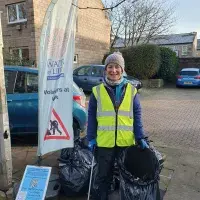 Dr. Martha Koerner litter picking for Water of Leith Conservation Trust. Staff volunteering.