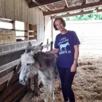 Karen Scott with Dylan, one of the resident donkeys at the Scottish Borders Donkey Sanctuary. Staff volunteering.