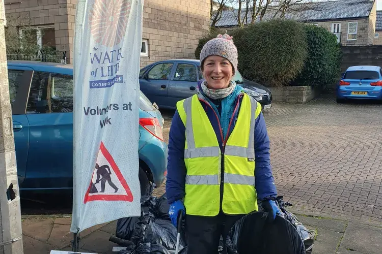 Dr. Martha Koerner litter picking for Water of Leith Conservation Trust. Staff volunteering.
