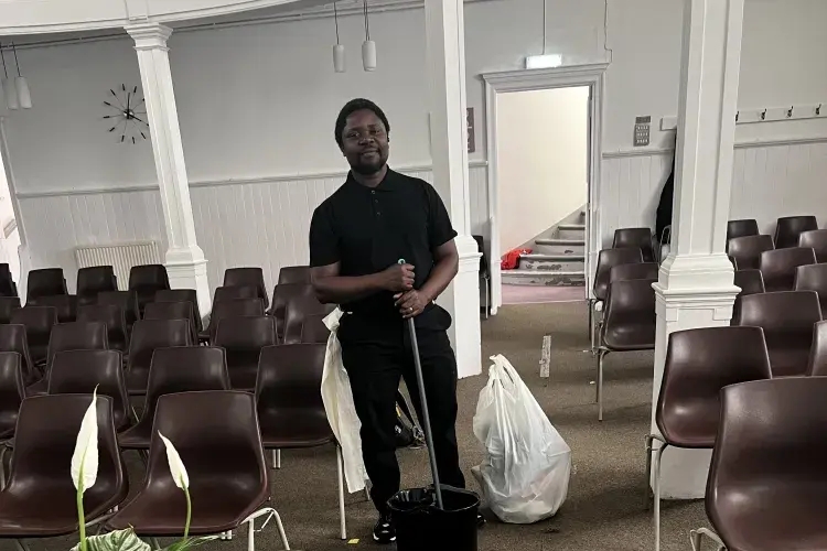 Elisha Lugoloobi, Life Church Edinburgh cleaning tasks. Staff volunteering.