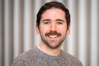 A photo of Dr Dom Cairns-Gibson