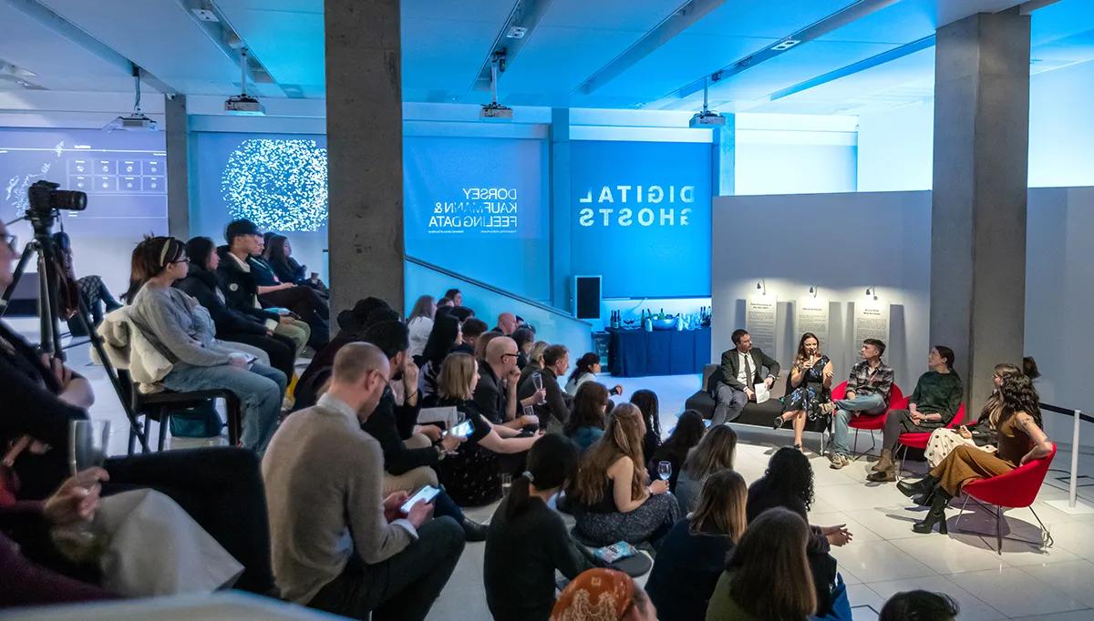 Audience members listen to a panel discussion at an Inspace event
