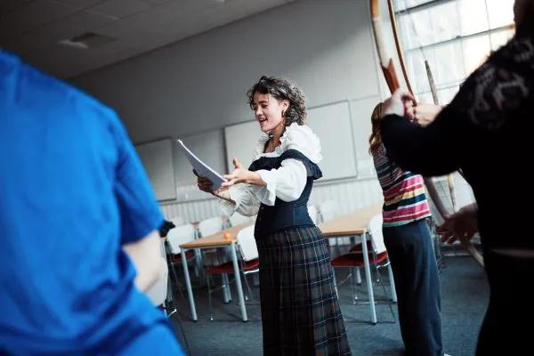  A person performs from a script