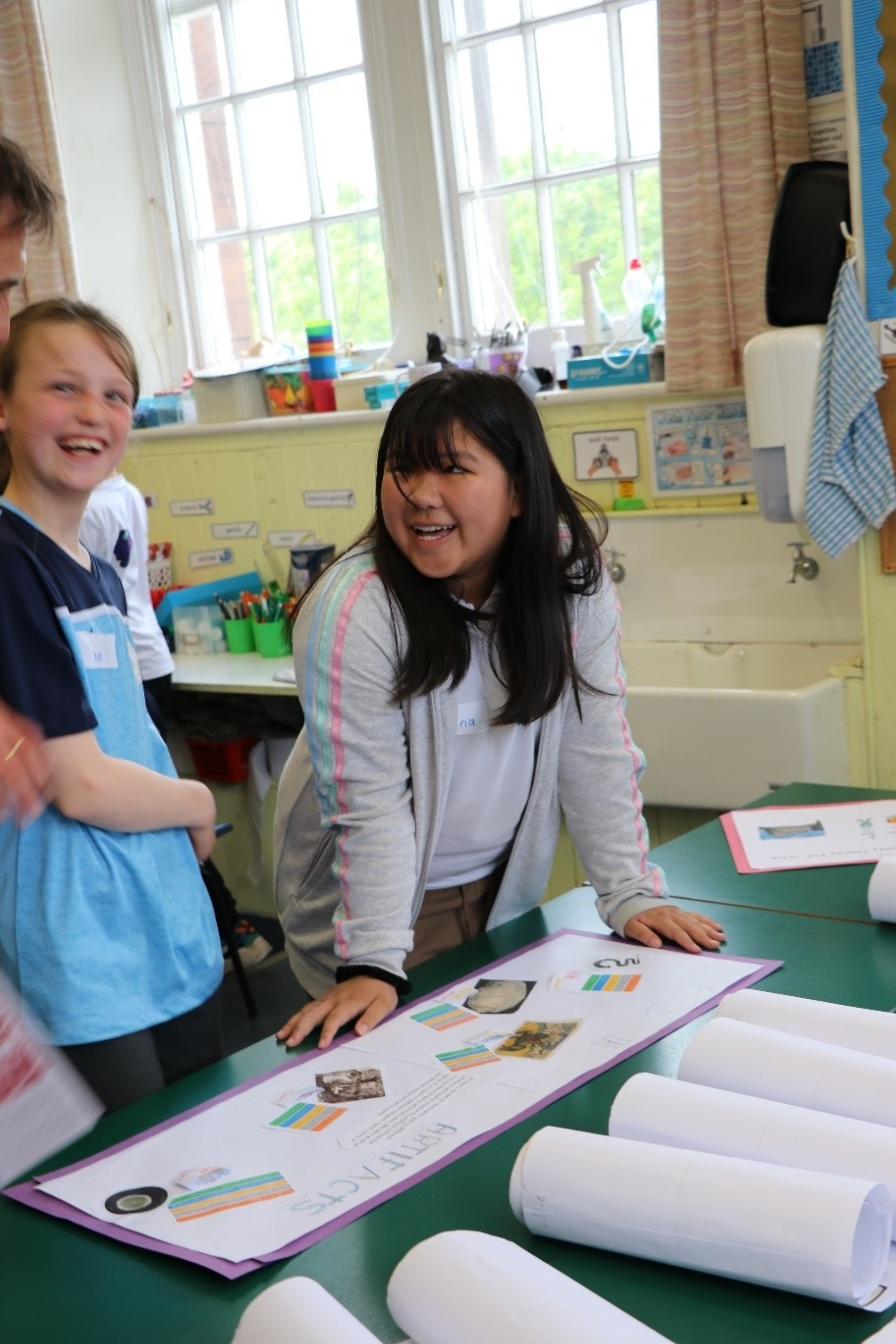 P6 students looking at school projects created based on University collections